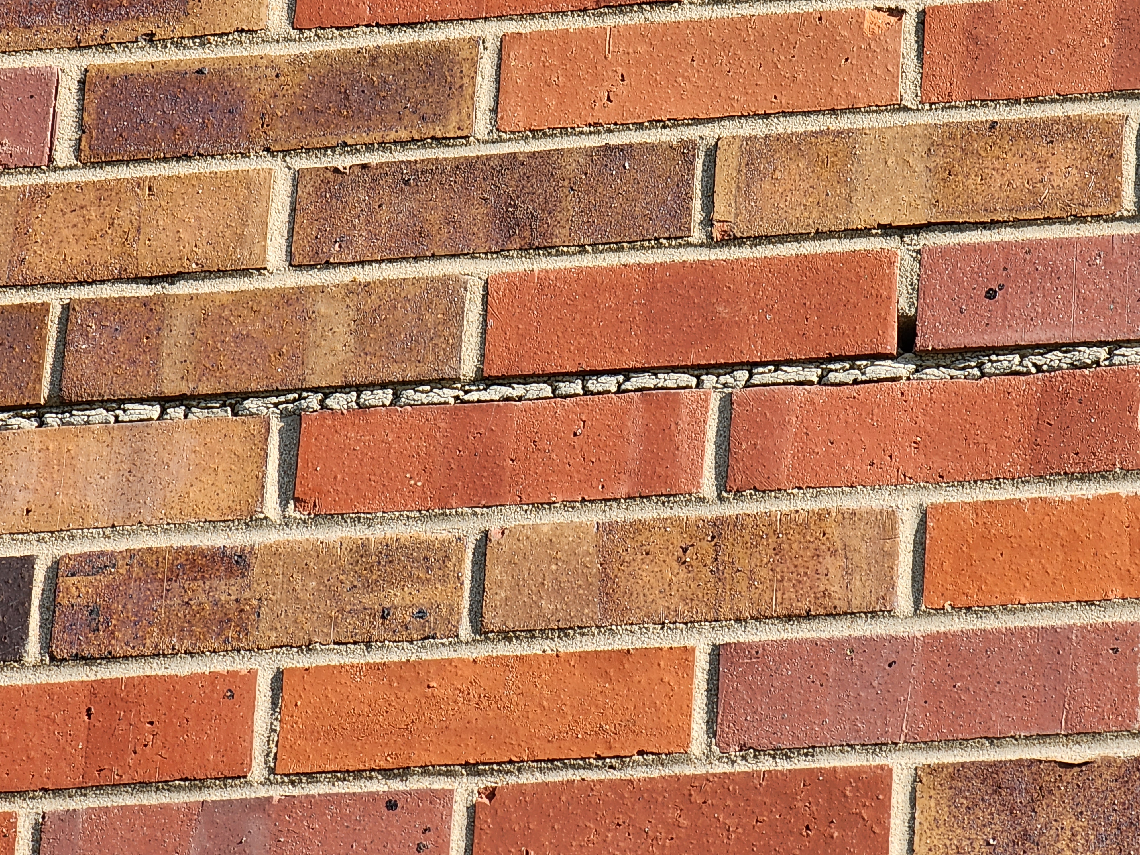 Sealant being applied to a masonry joint